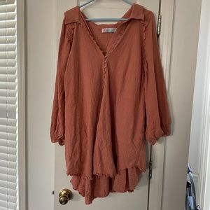 Free people tunic in rust. Back is longer than front
